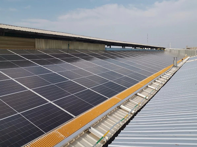 Solar panel installation on warehouse rooftop